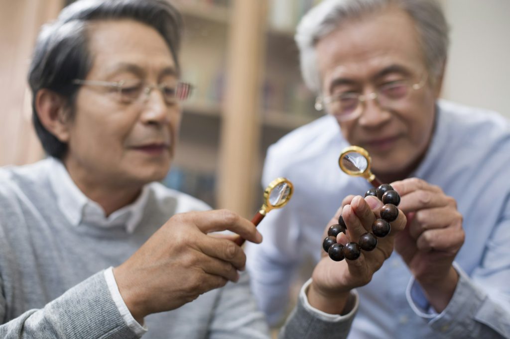 Senior men admiring antiques